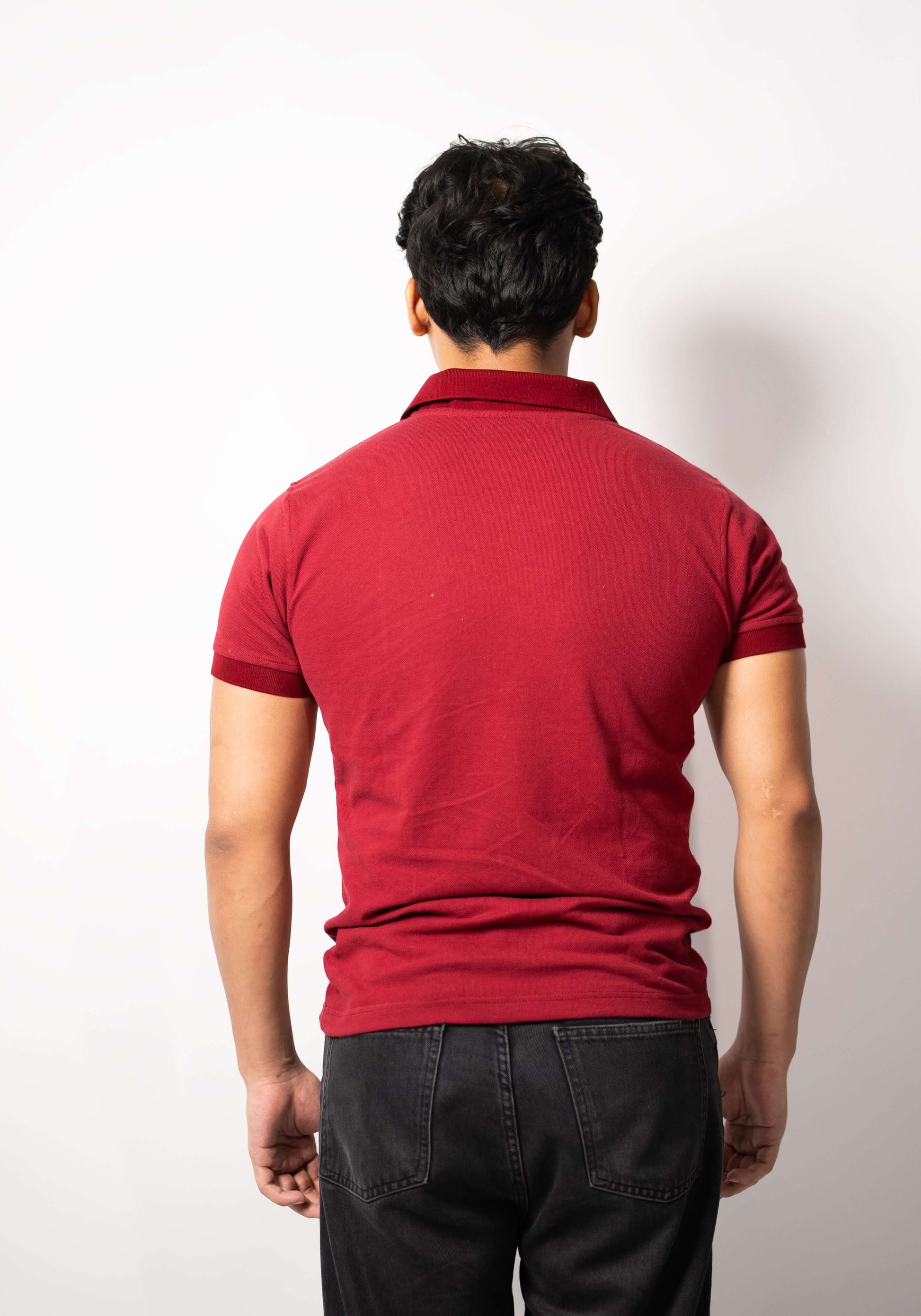 Back side of red Hault polo shirt with clean finish
