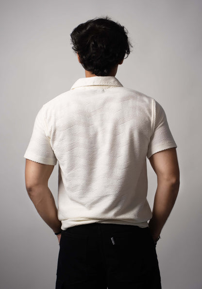 Back view of white Jacquard polo with soft bio-washed finish